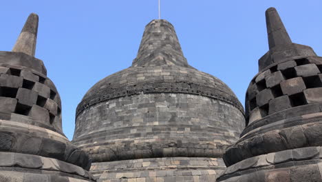 the top of borobudur temple with stupas.