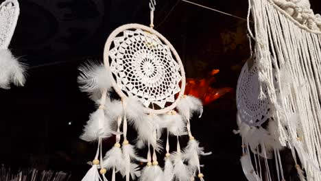 Multiple-Dreamcatchers-hanging-up-for-sale-on-market-stand-right-pan