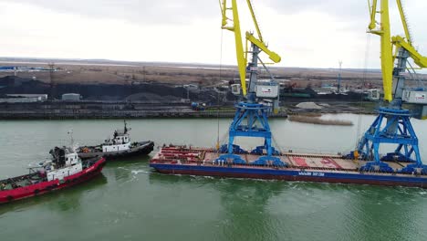 port operations with cranes and barge