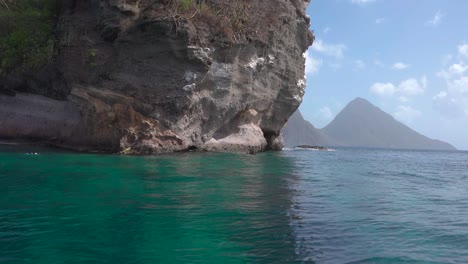 Slow-motion-revealing--piton-mountains-from-a-boat