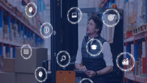 using tablet with animation of digital icons, warehouse worker managing tasks