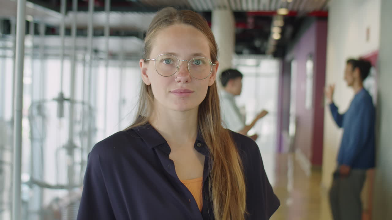 Portrait of Young Beautiful Businesswoman in Office Center