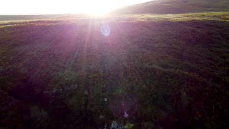 flying into the sun , then revealing the horizon in the northern english moorlands