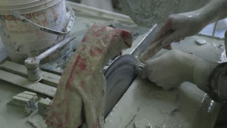 macro stone cutting in a dusty workshop