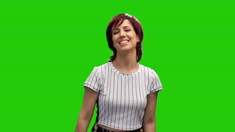 Portrait-of-adorable-woman-posing-on-green-screen-showing-call-me-gesture-with-hand