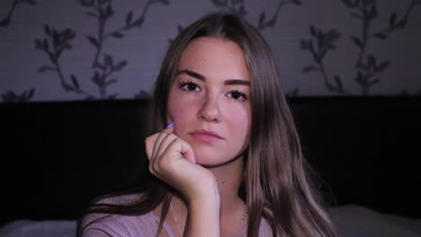 Beautiful-upset-and-bored-teenage-sitting-in-her-room