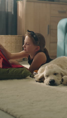 girl and puppy playing together