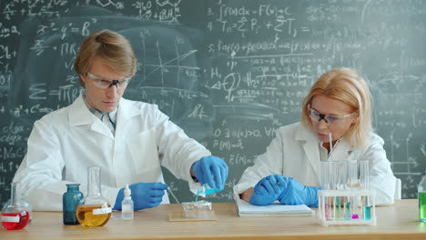 Scientists Conducting a Chemistry Experiment in a Laboratory