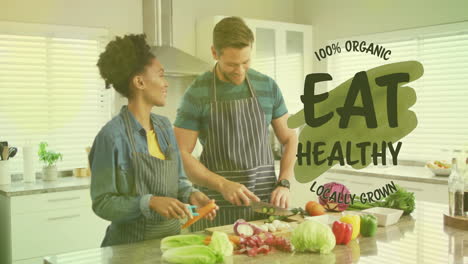 Animation of eat healthy text over diverse couple preparing healthy meal in kitchen