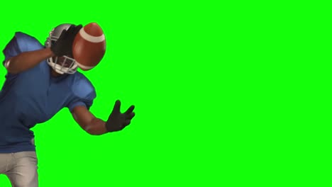 american football player catching ball