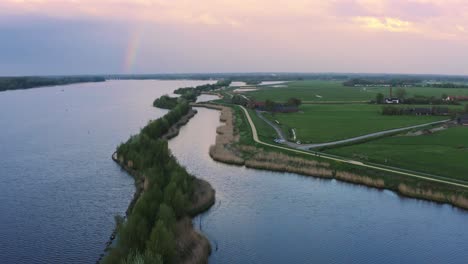 arkemheen polder nature reserve with rainbow in horizon