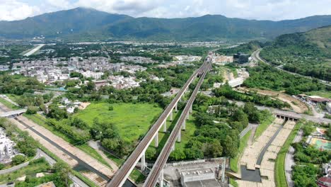 hong kong mtr railroad in the city outskirts, aerial view