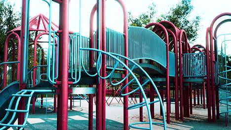 empty swings on summer kids playground