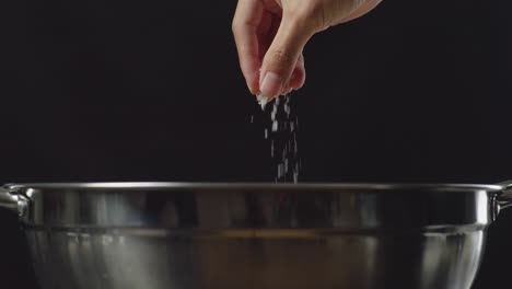 adding salt to food