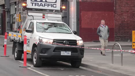 traffic control vehicle and pedestrians in city street