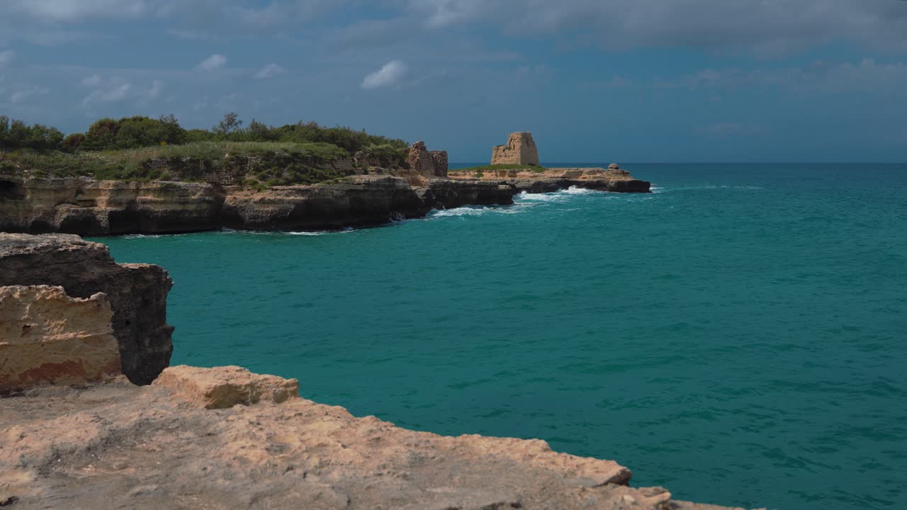 Ancient coastal tower of Maradico at the Adriatic Sea at Cave of Poetry. Cultural site, Apulia Italy