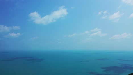 aerial background of an endless blue ocean on a summer day