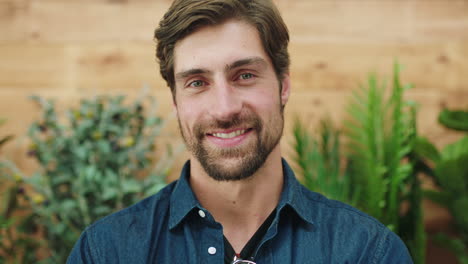 man, smile and face, happy with plants