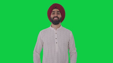Fröhlicher-Sikh-Indianer,-Der-Fliegende-Küsse-Auf-Grünem-Bildschirm-Gibt