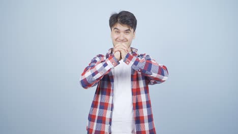 카메라를 보는 남자가 자신감을 나타 ⁇ 니다.