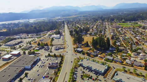 cityscape aerial view of suburb commercial-residential district and roads in port alberni region, british columbia canada