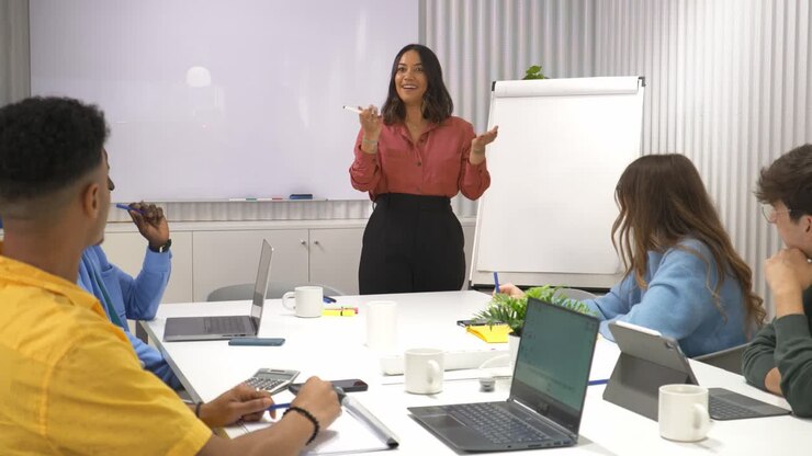 Businesswoman leading presentation during office meeting