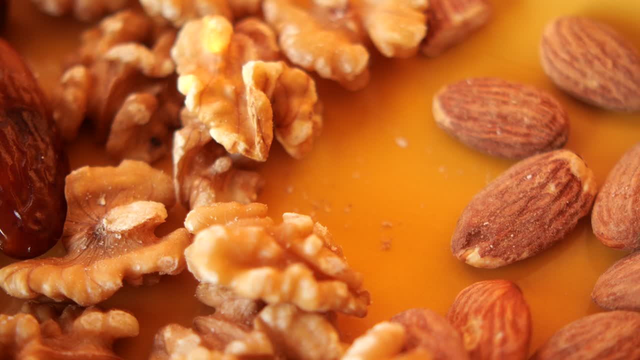 Close Up Of Walnuts, Almonds, And Dates
