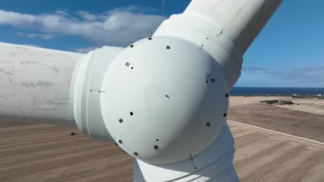 Very-close-orbiting-shot-of-wind-turbines-spinning