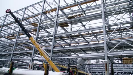 industrial construction site with metal framework and piping