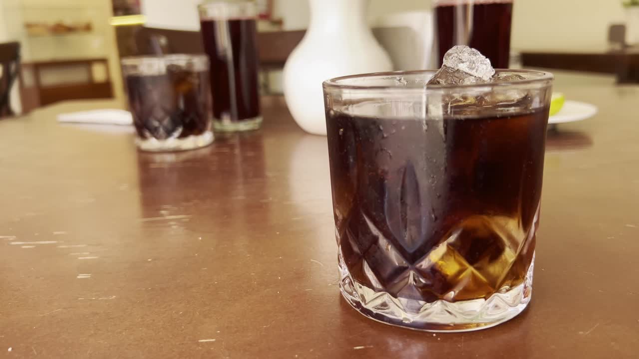 carbonated soft drinks of various types on decorated cafe table