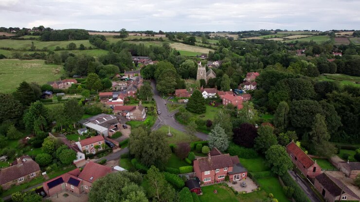 Aerial video footage of the remains of Bolingbroke Castle a 13th century hexagonal castle, birthplace of the future King Henry IV, with adjacent earthwork