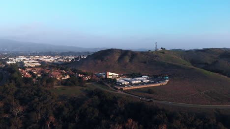 aerial rotation around a church at sunset in a suburban city