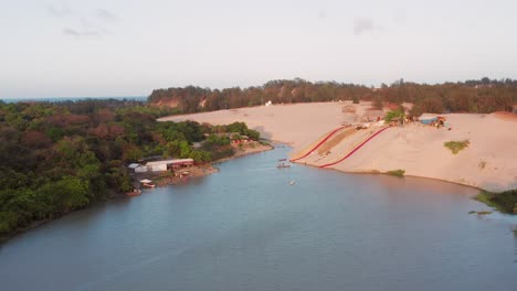 Aerial:-Sand-and-waterslides-in-the-dunes-of-Cumbuco,-Brazil