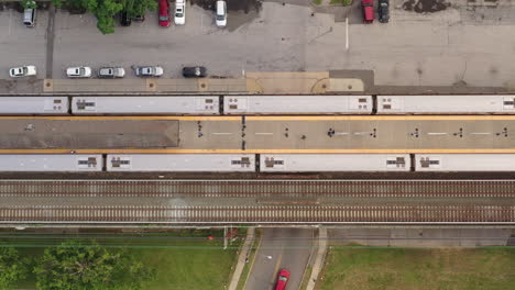 a top down shot directly over two trains parked at a station