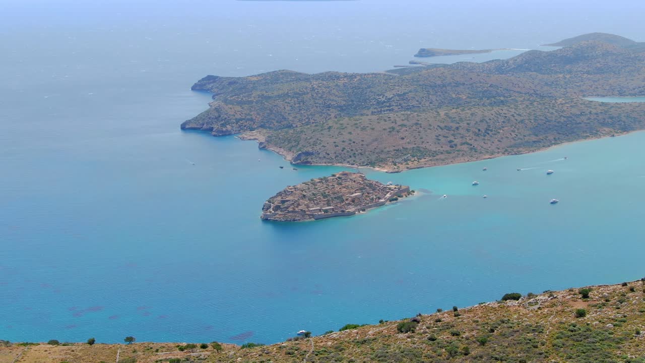 Panorama view of island in ocean with boats from mountain top, Crete