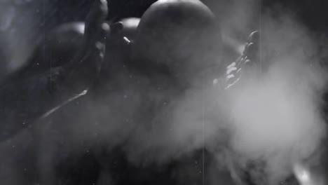 animation of scratches, smoke and red light over scary zombie in corridor holding head in pain