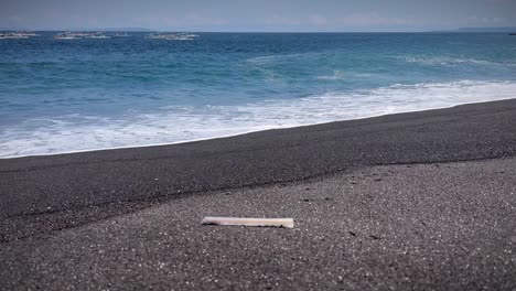 trash washed ashore of bali beach in indonesia