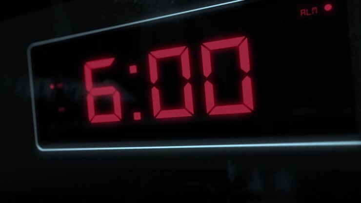 High quality CGI render of a digital alarm clock, with glowing red numbers, ticking over from 5