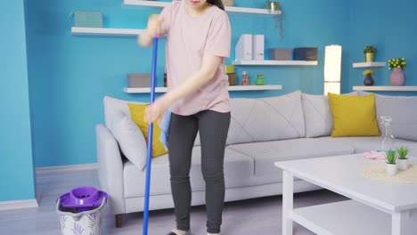 happy asian young woman cleaning at home and getting tired.