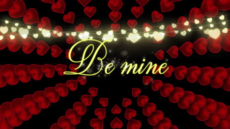 be mine text with hearts appearing on black background