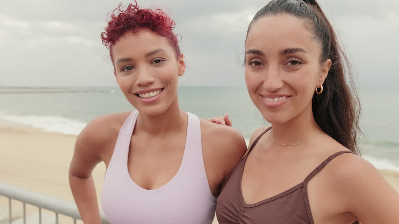 Two Fit Women Taking a Selfie After Beach Workout
