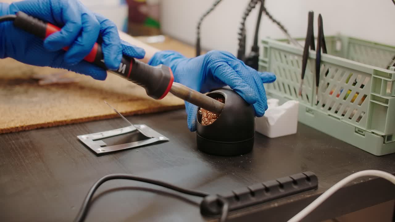 Soldering station being used at a workbench