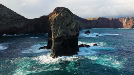 rough waves hitting rock formations at ponta de sao lourenco coast, madeira island, portugal