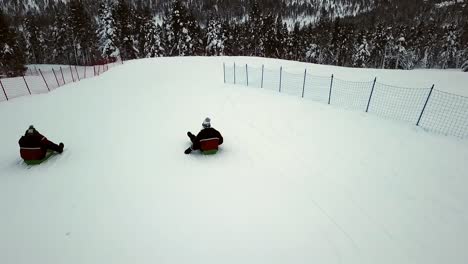 tobogganning in saariselka, lapland, finland