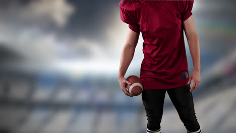 Male-rugby-player-against-sports-stadium-in-background