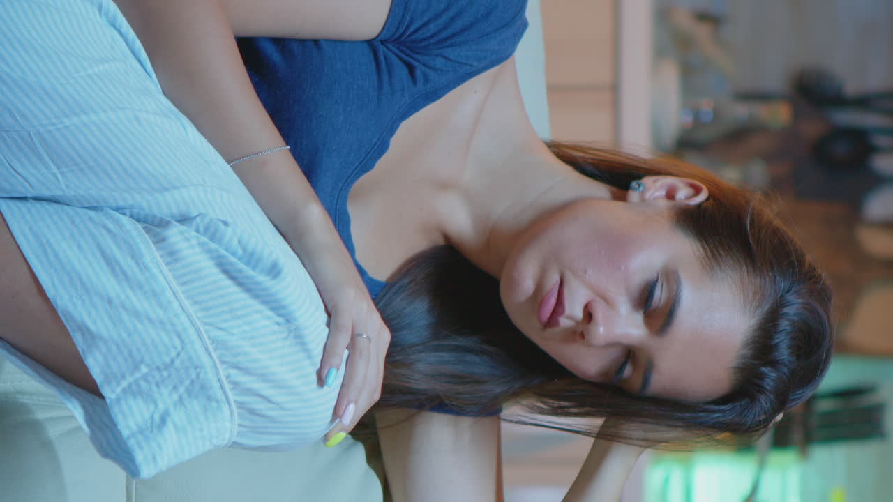 Vertical Video: Lady Asleep On Sofa Alone In Living Room