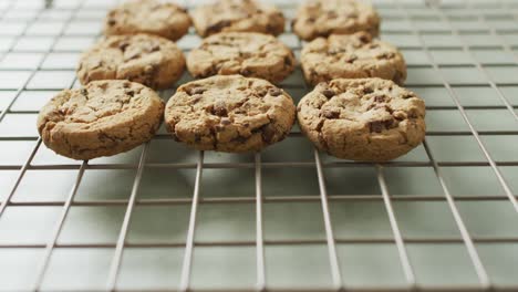 Video-of-rows-biscuits-on-a-baking-rack-over-white-background