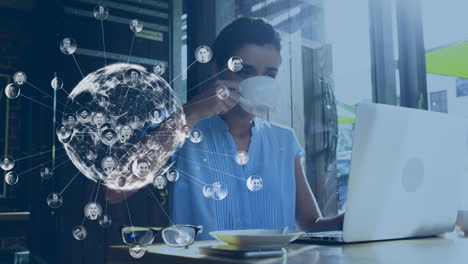 animation of globe with network and photos over caucasian woman using laptop