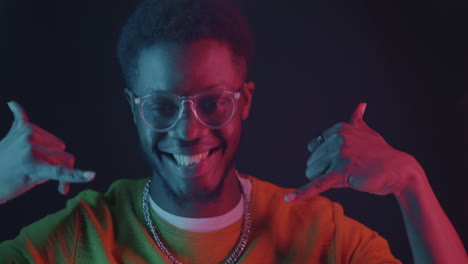 joyful man in neon lighting