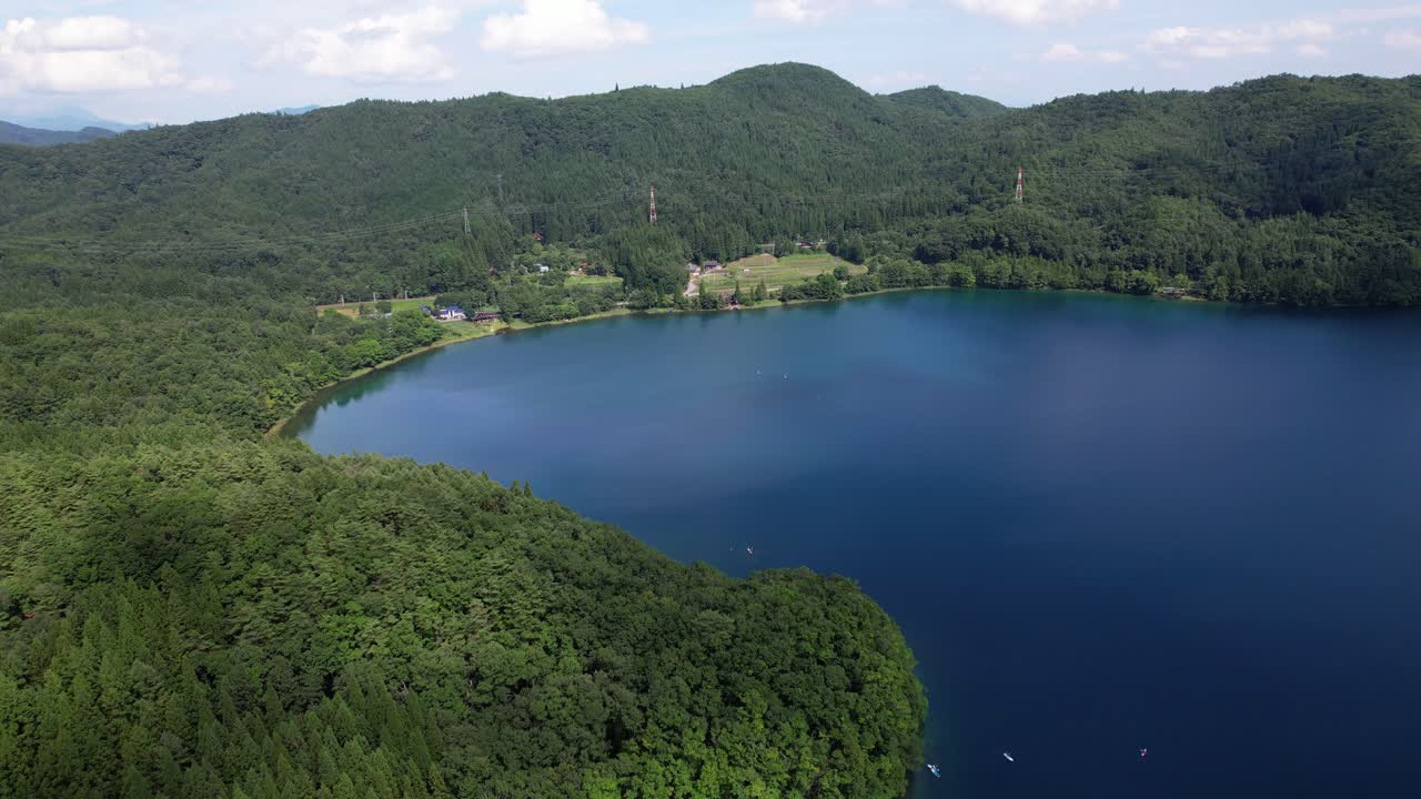 Pristine And Tranquil Waters Of Lake Aoki In Omachi Mountainous City In Nagano Prefecture, Japan. Aerial Shot